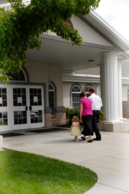 Family going to church in a Mormon Meetinghouse